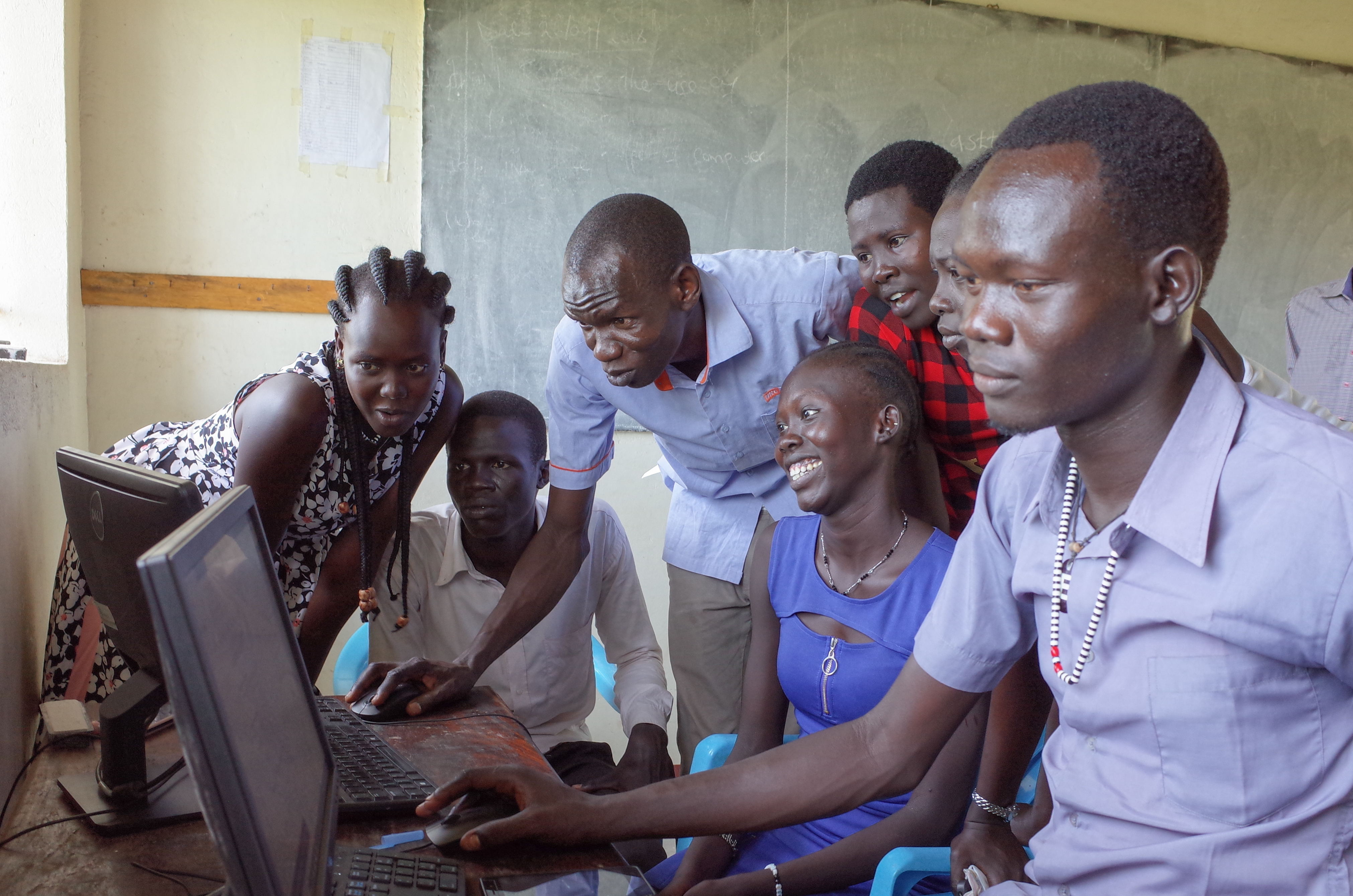 Students looking at a laptop