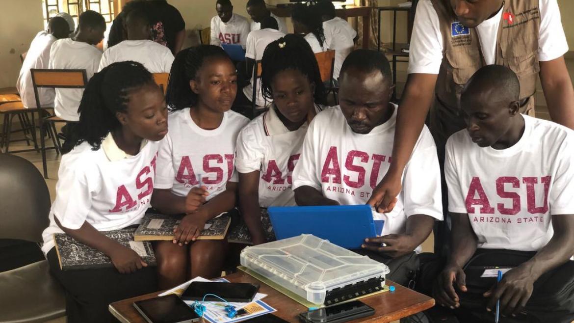 Students studying while reviewing the laptop screen